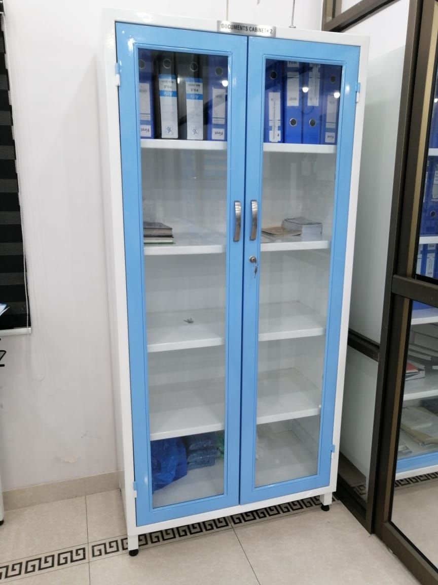 Glass-door laboratory storage cabinet with reagents